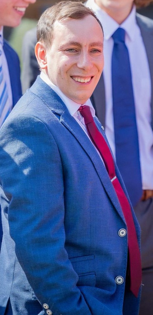 Andrew Quann smiling outdoors